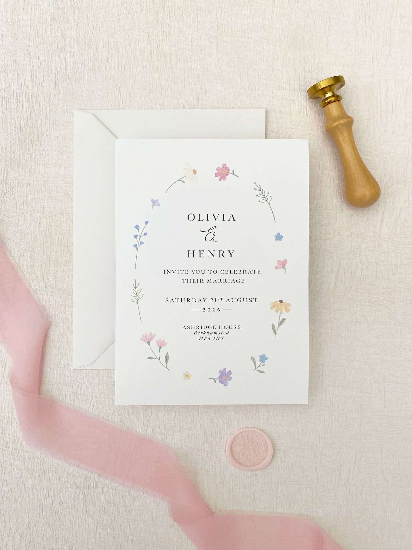 Wildflower invitation background featuring delicate spring flowers for wedding stationery