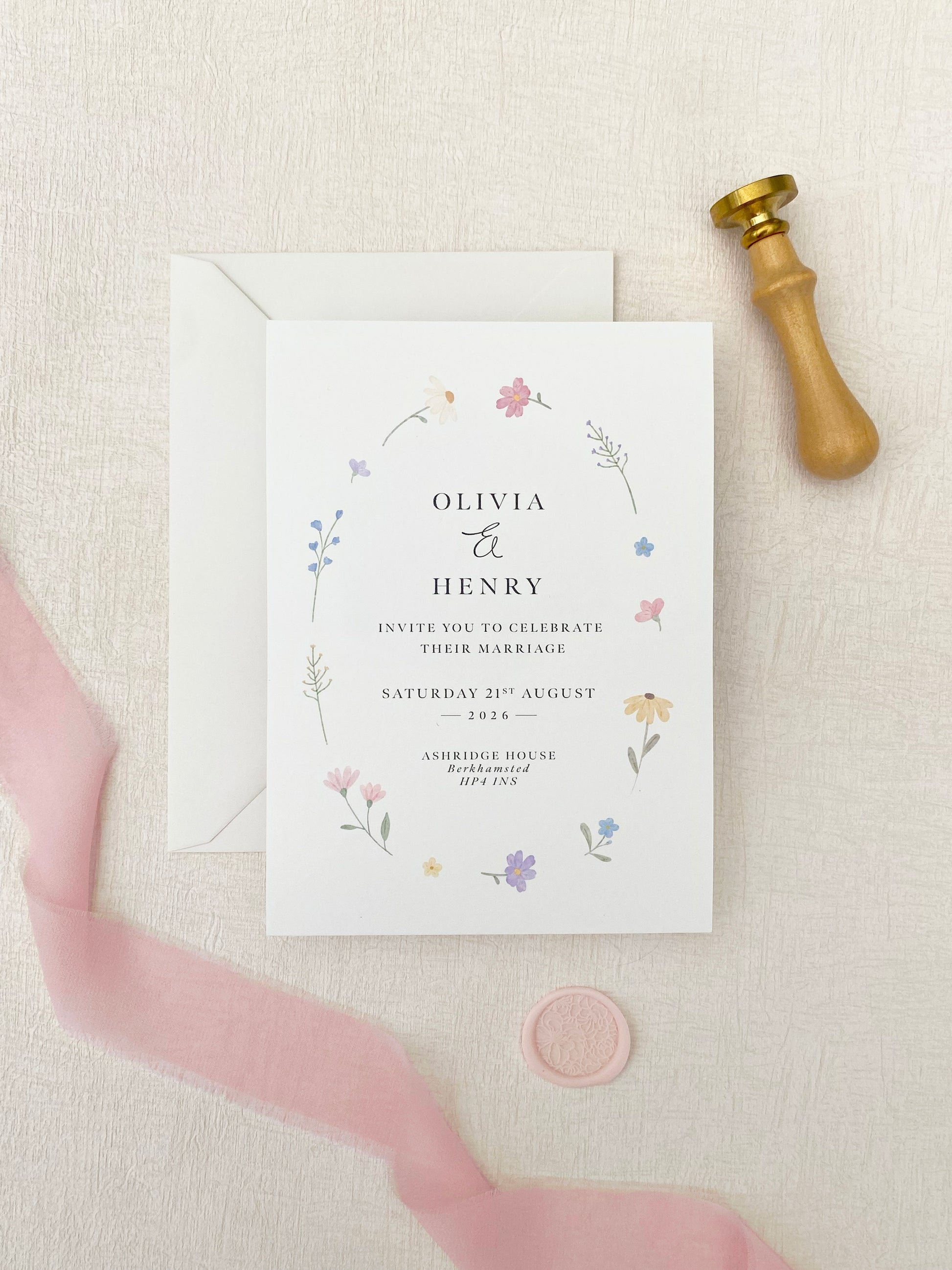 Wildflower invitation background featuring delicate spring flowers for wedding stationery