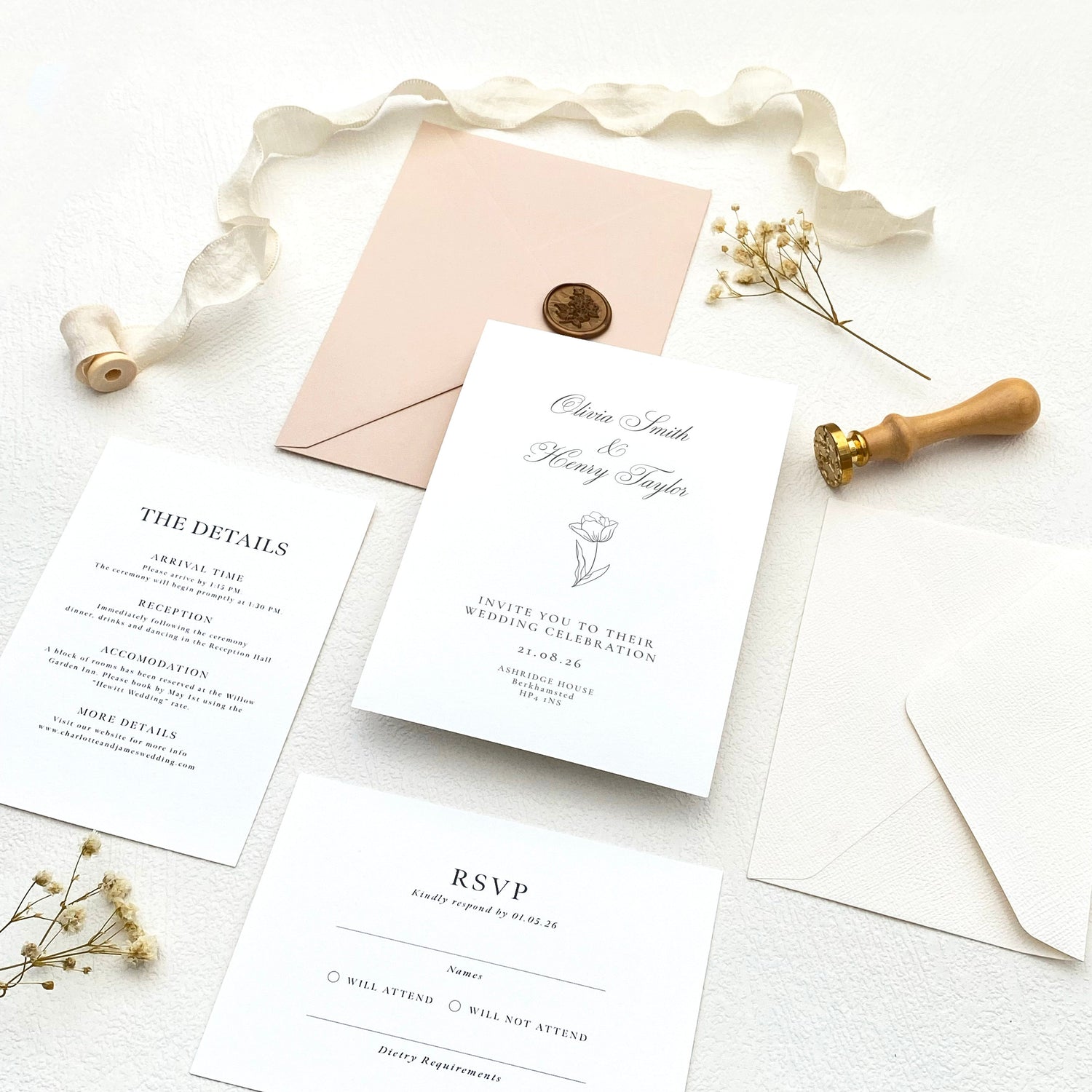 Flat lay of a luxury custom wedding invitation suite in muted tones featuring elegant typography and coordinated stationery.