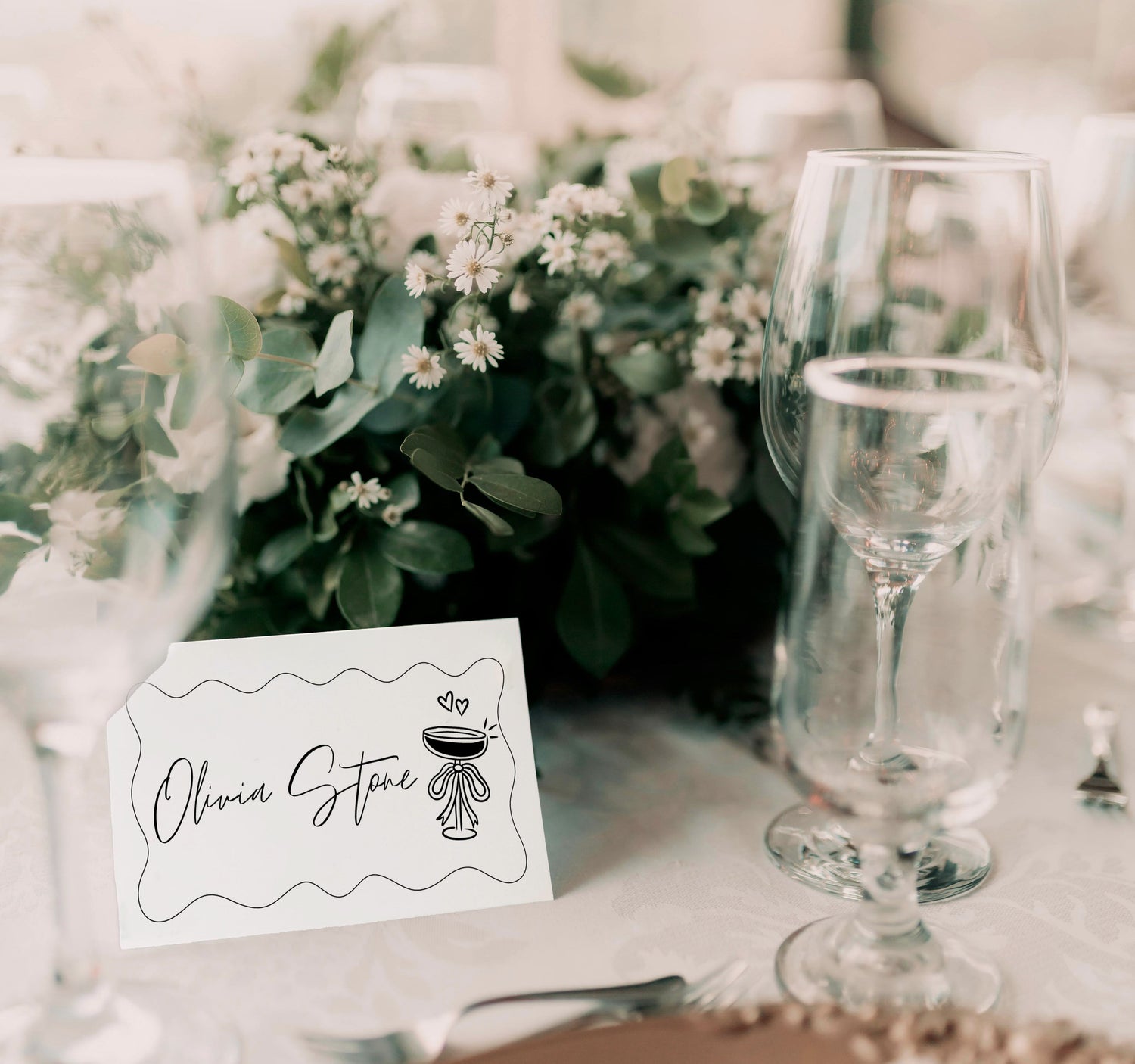 Minimal wedding place card featuring a delicate hand-drawn design and elegant typography, ideal for modern wedding table settings.