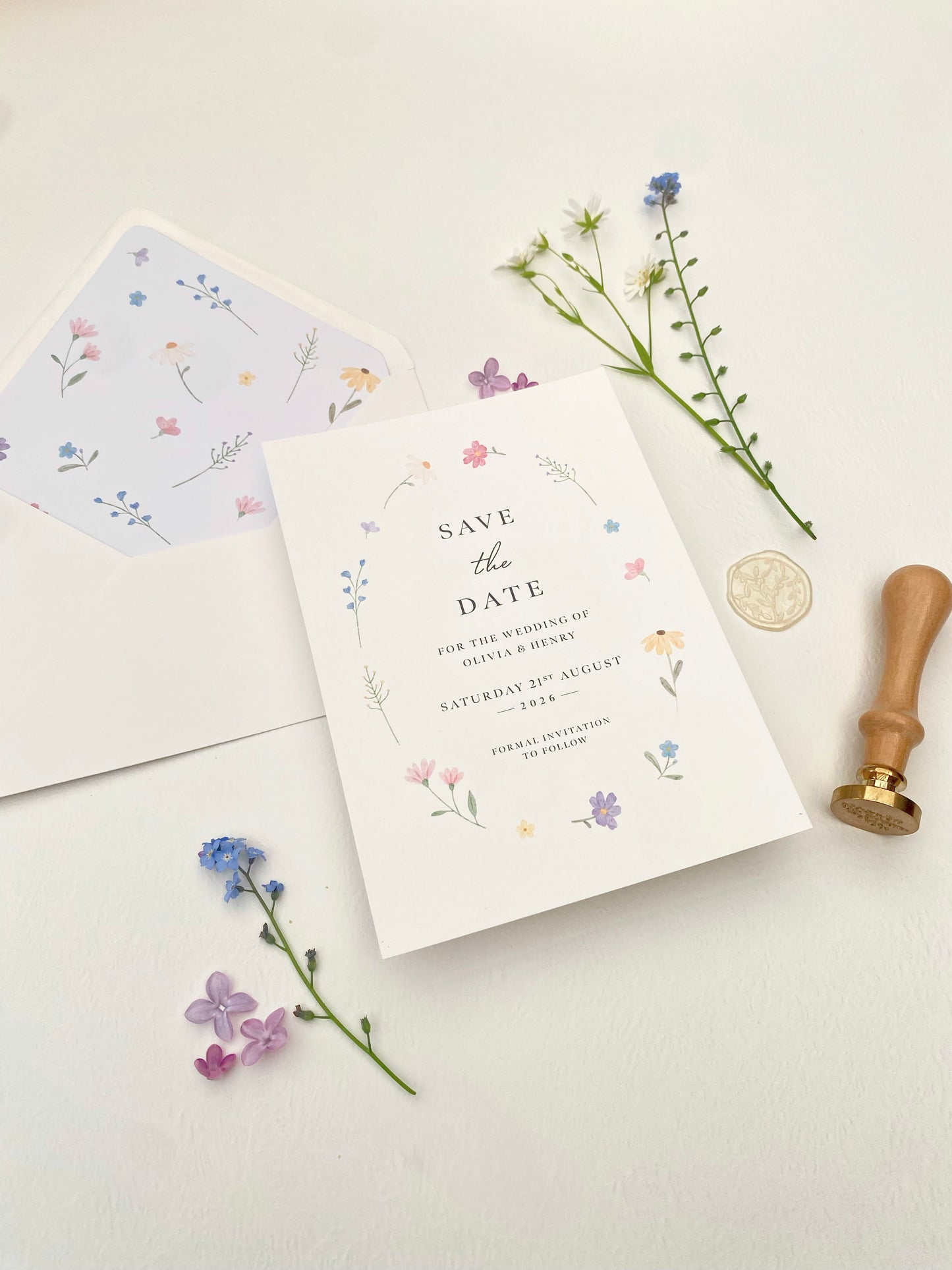 Romantic spring save the date card with hand drawn wildflower illustration for wedding announcement