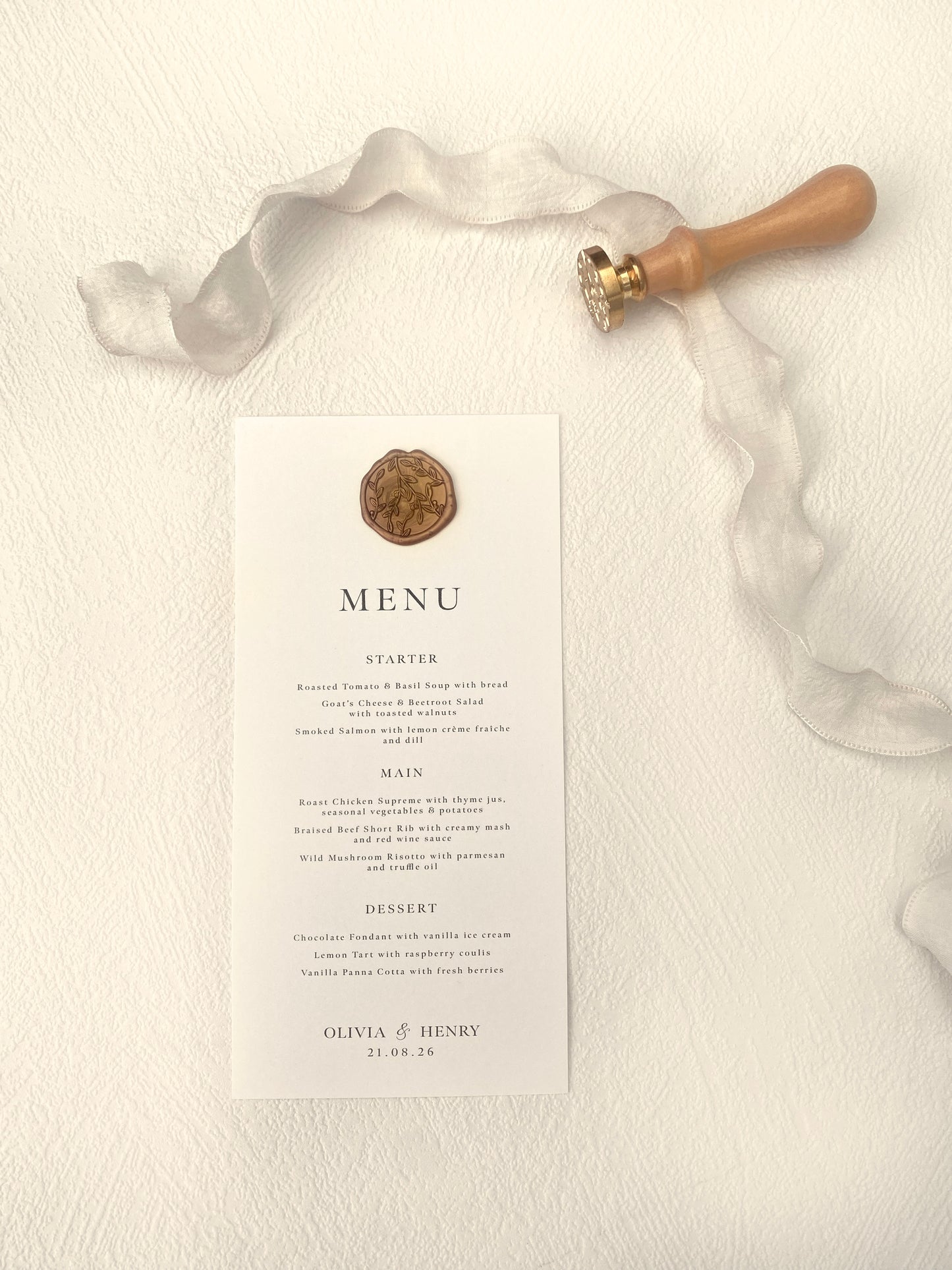 Menu card with a decorative emblem on a textured surface