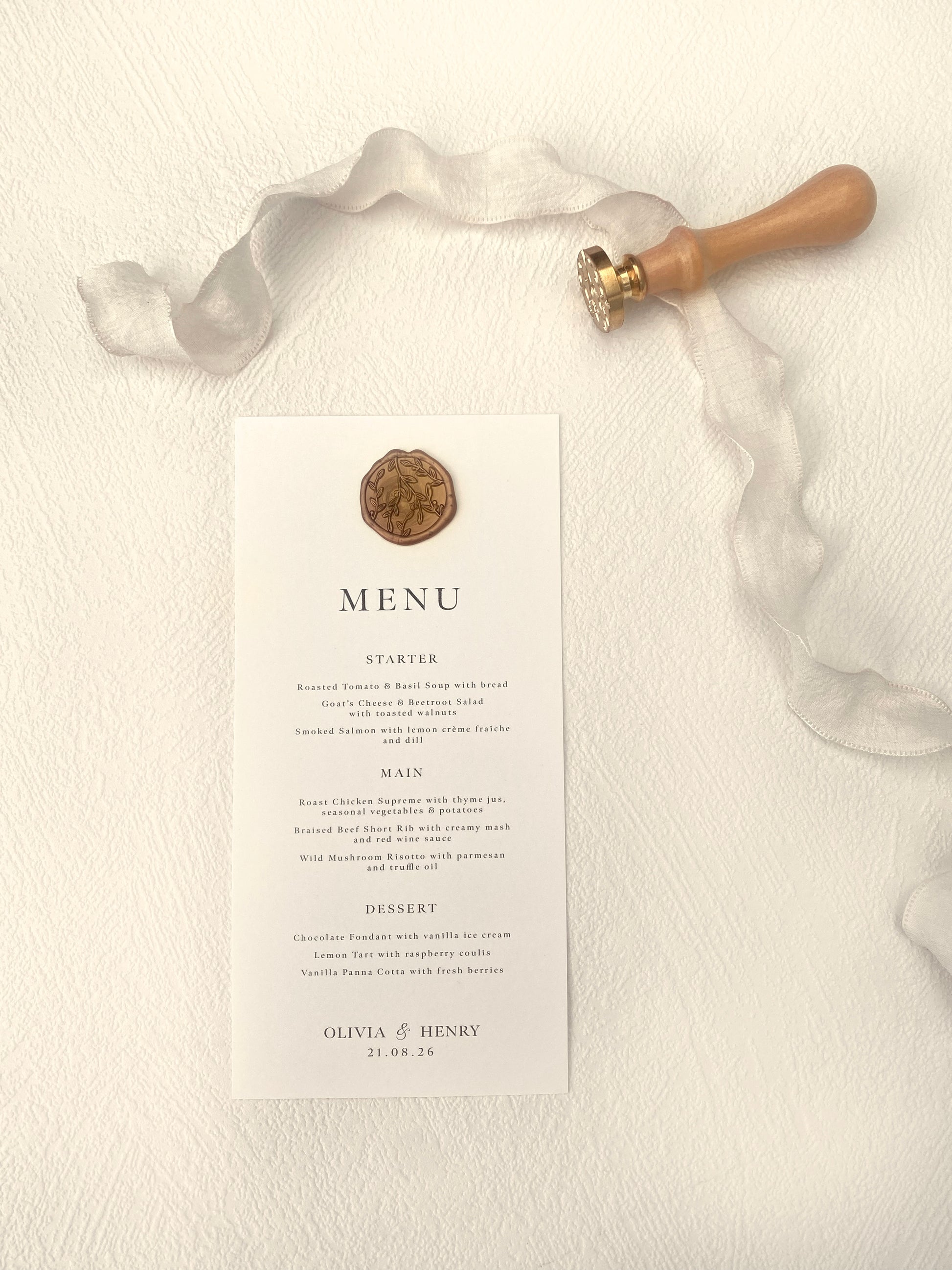 Menu card with a decorative emblem on a textured surface