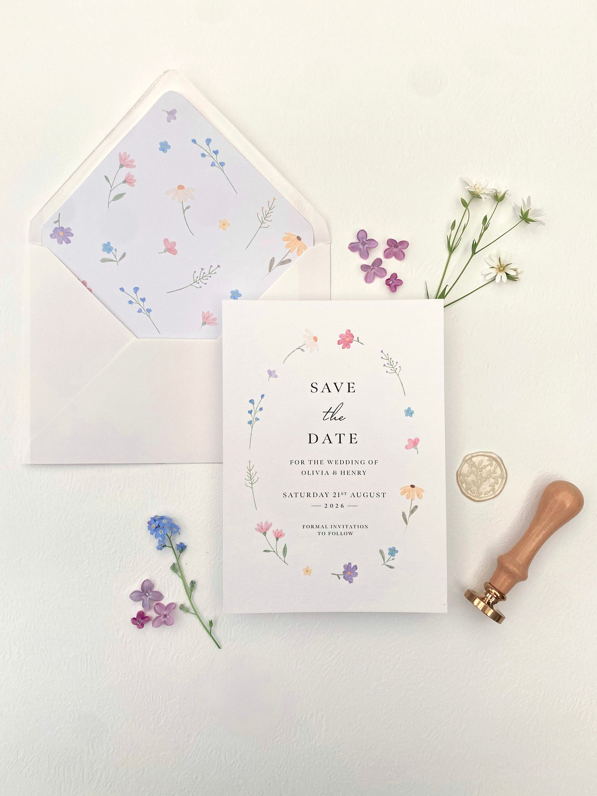 Wildflower wedding theme save the date with soft pastel spring flowers and modern typography